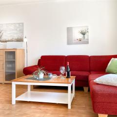 Sitzecke mit Sideboard im Wohnraum der Wohnung W4 im Gästehaus Christian-Westphal-Straße 60