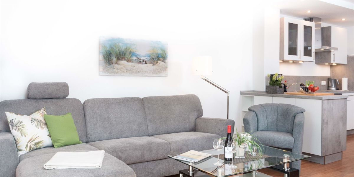Moderne, graue Sitzecke in der Wohnung W6 im Gästehaus Christian-Westphal-Straße 60